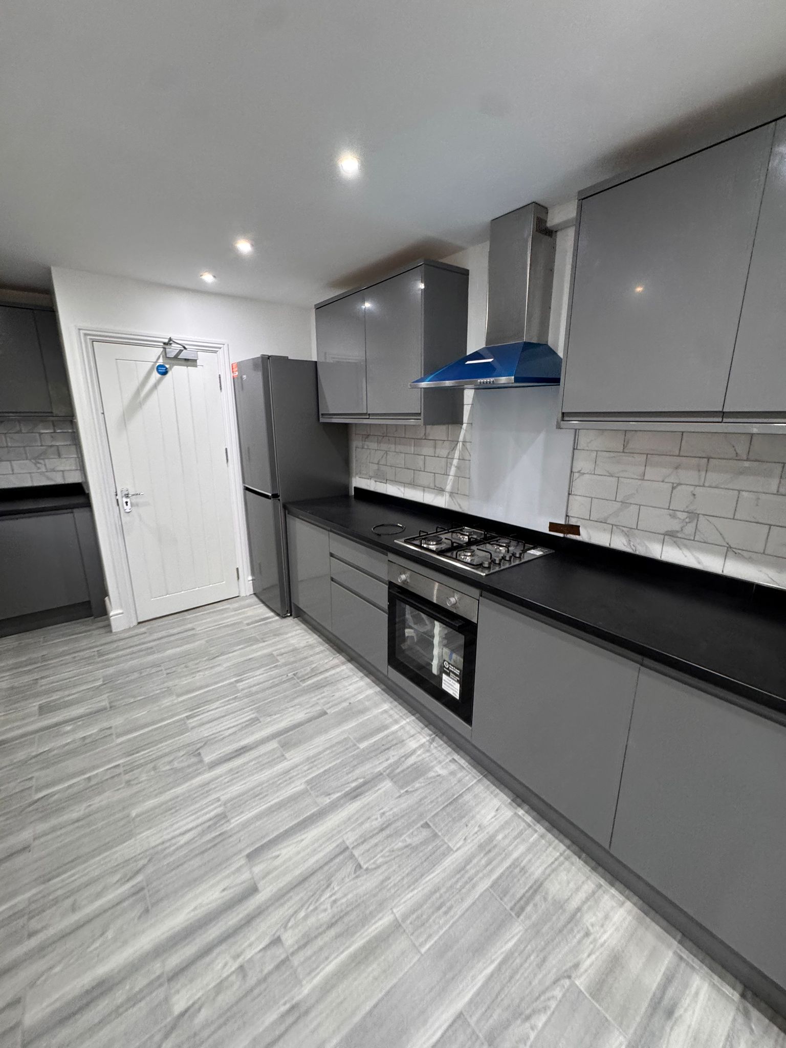 Full view of open-plan kitchen with island